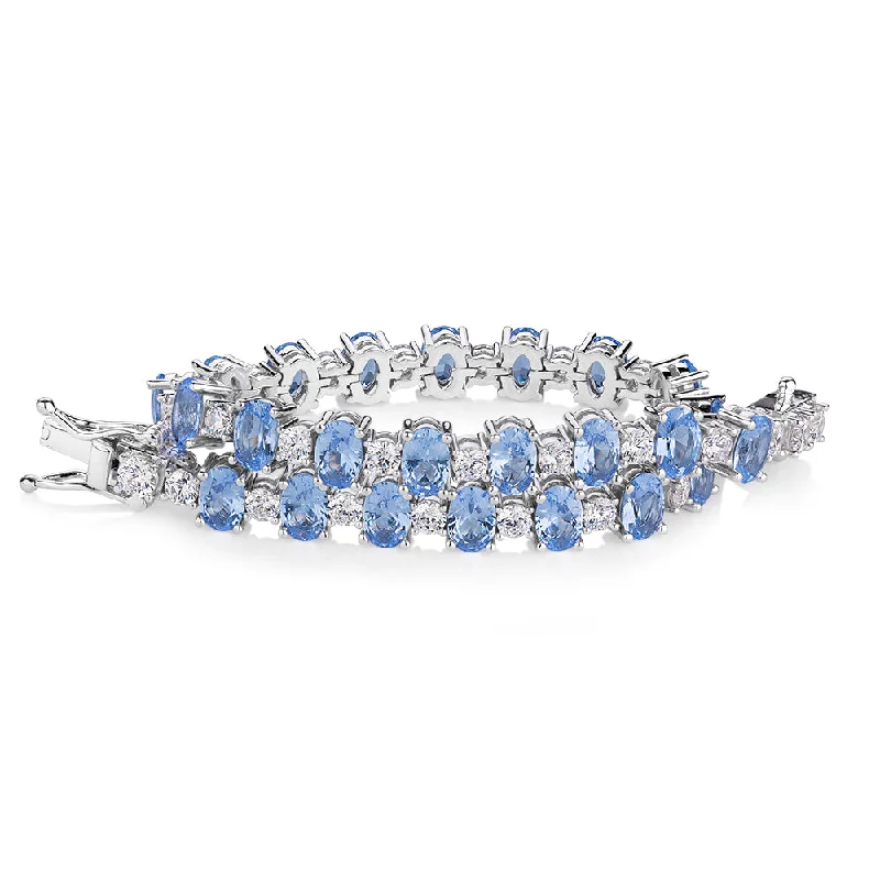 silver charm bracelets for women -Oval and Round Brilliant tennis bracelet with blue topaz simulants and 3.26 carats* of diamond simulants in sterling silver