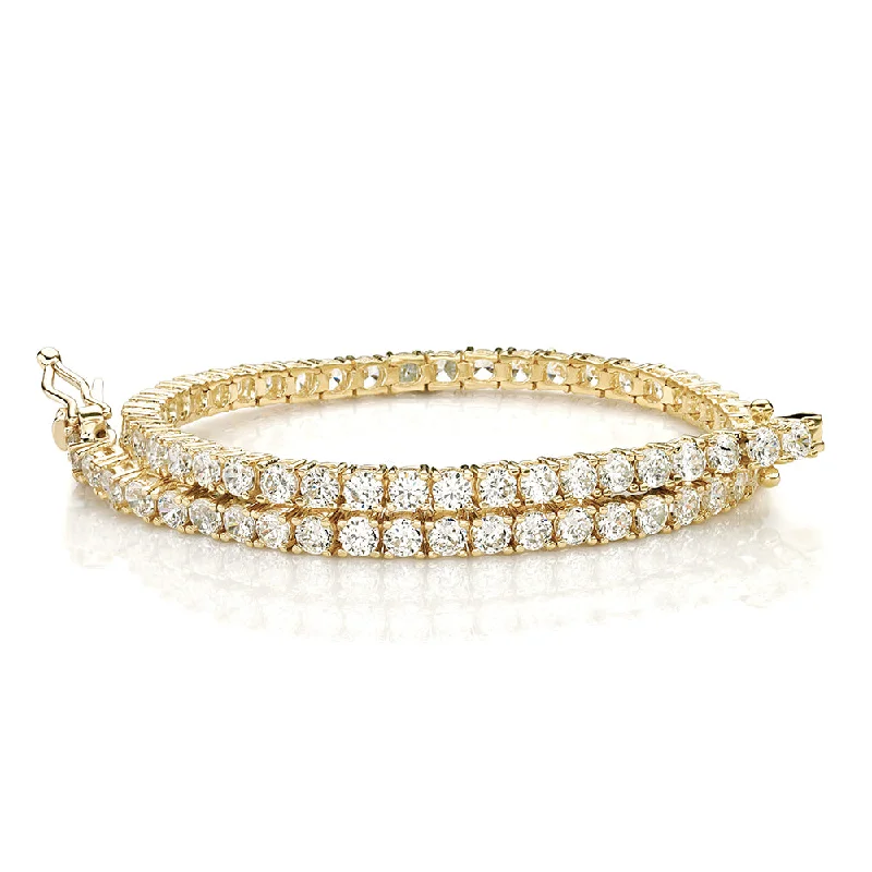 chunky bracelets for women -Round Brilliant tennis bracelet with 4.02 carats* of diamond simulants in 10 carat yellow gold