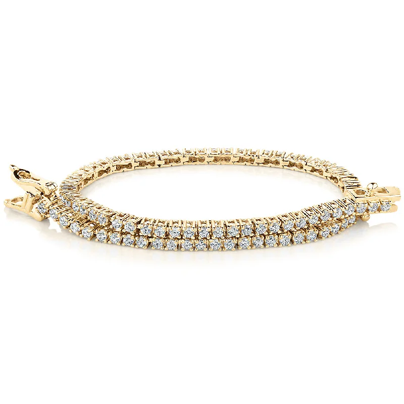 gold bracelets for women -Round Brilliant tennis bracelet with 1.29 carats* of diamond simulants in 10 carat yellow gold