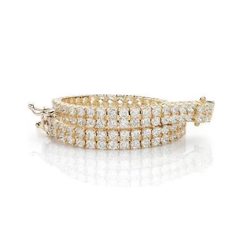 stacked bracelets for women -Round Brilliant tennis bracelet with 13.86 carats* of diamond simulants in 10 carat yellow gold